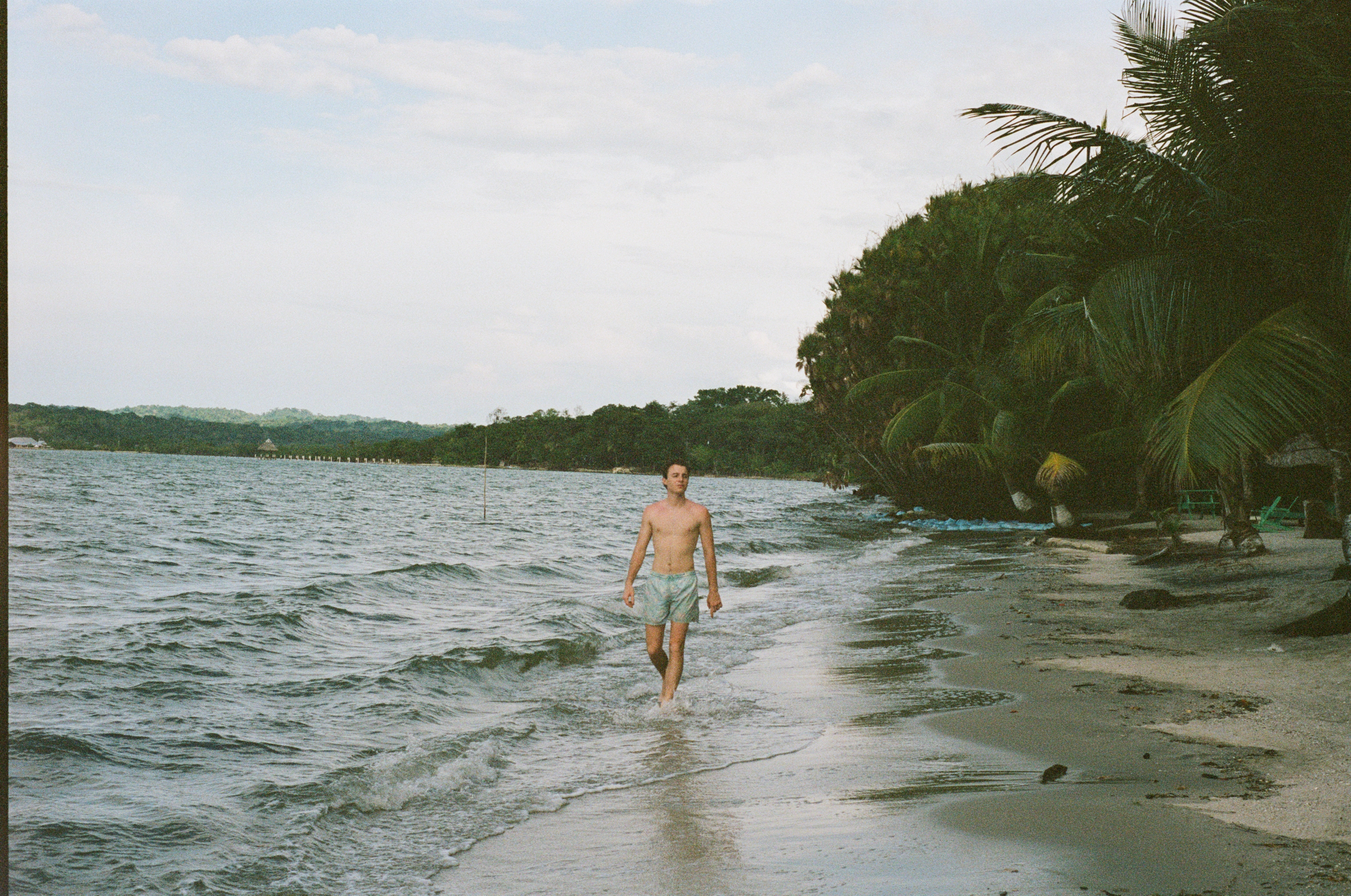 Man walking on a tropical beach
